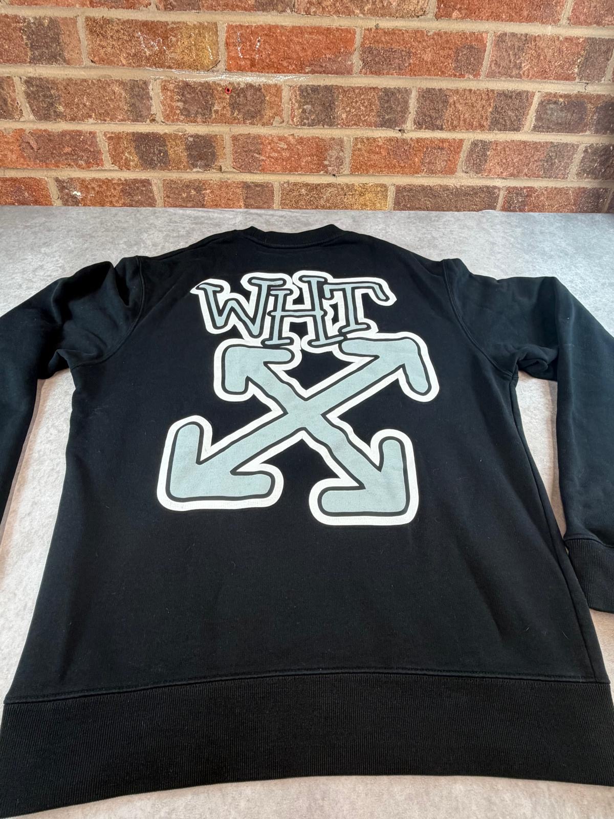 Back of the sweatshirt flat-laid, arrows graphic in full